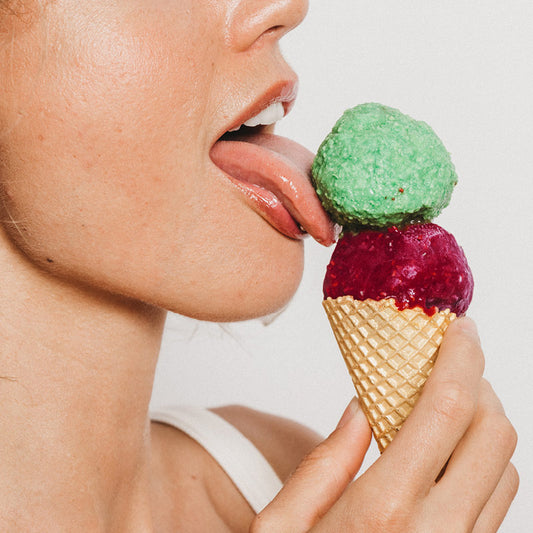 Woman licking ice cream