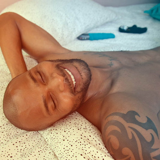Man lying in bed satisfied