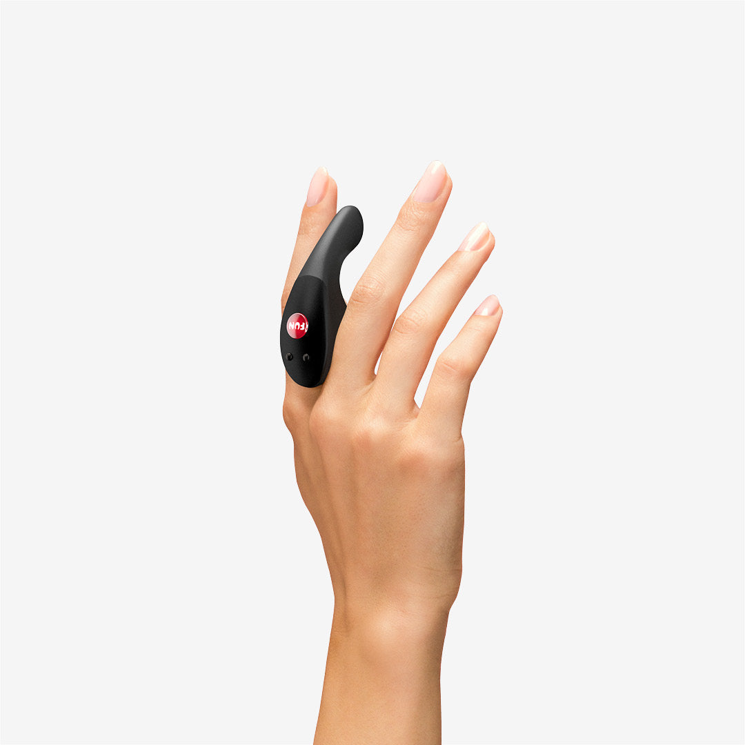 BE·ONE in black placed between the fingers